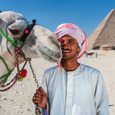 Bedouin with camel, pyramids on the background, Giza, Egypt.http://bhphoto.pl/IS/egypt_380.jpg